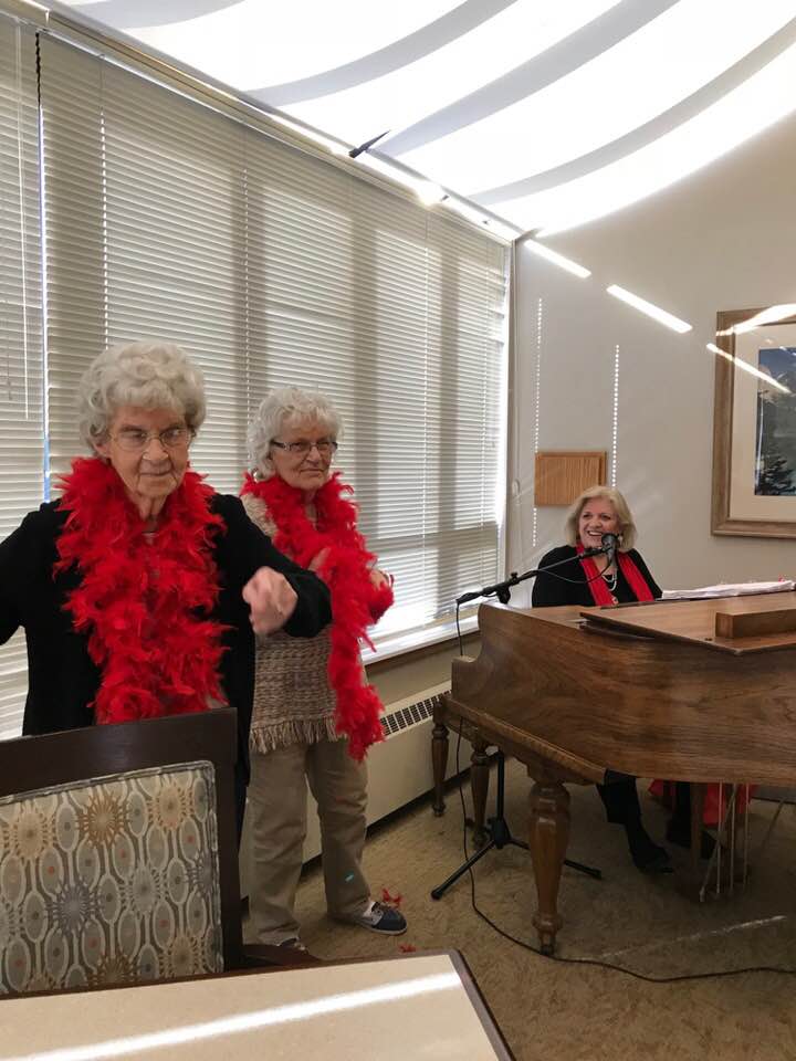  2 ladies being flirty at a Valentine gig 